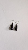 Teardrop shaped handmade ceramic earrings painted in chocolate brown and finished with sterling silver ear wires.