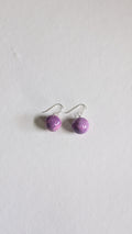 Handmade ceramic orb shaped earrings in lilac with sterling silver ear wires.