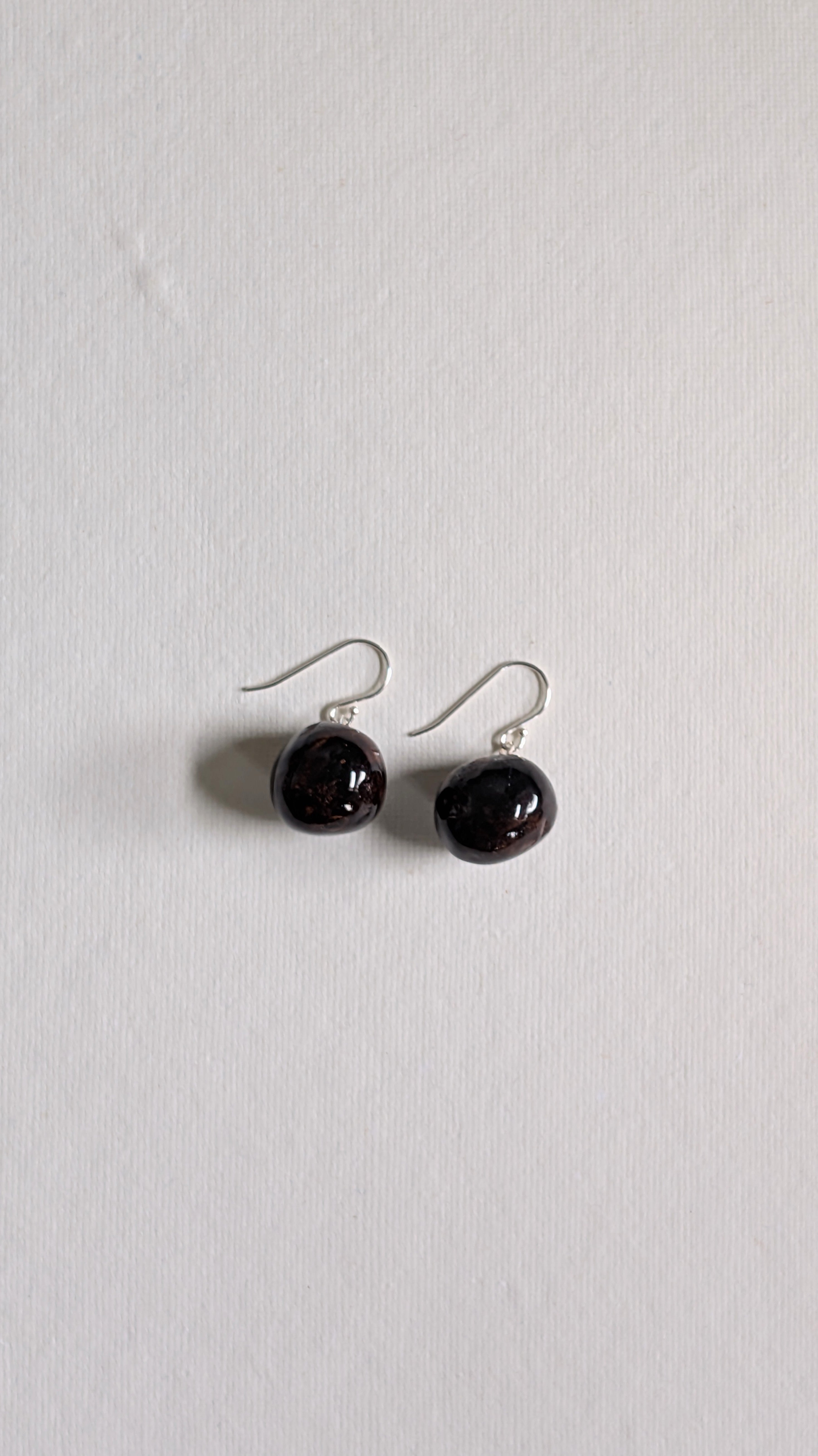 Hand painted ceramic orb earrings in chocolate brown with sterling silver ear wires.