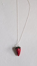 Hand painted ceramic strawberry necklace on sterling silver chain.
